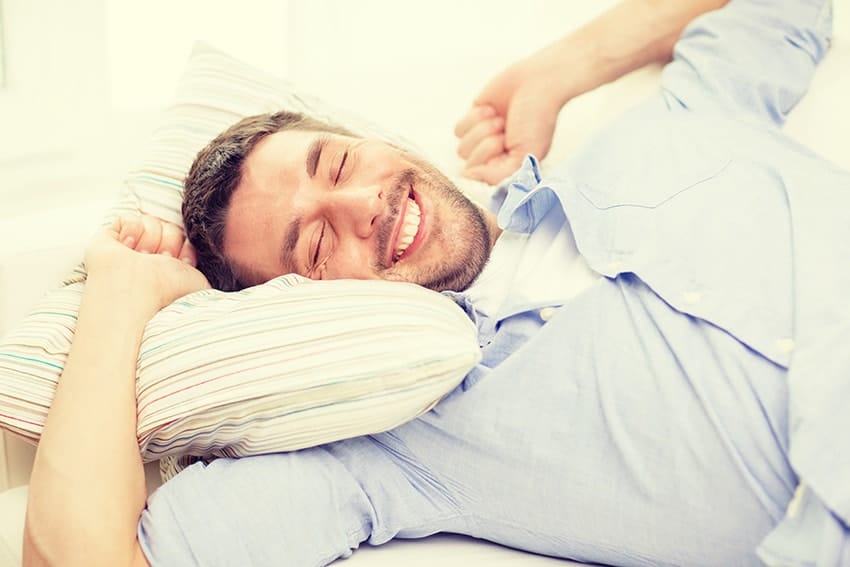 Young man stretching while waking up from a good nights sleep. Do you find yourself exhausted from a night of sleep, even though you got the recommended 8-hours of sleep? Have you changed your mattress and sleeping patterns and nothing seems to help? You may be suffering from sleep apnea.