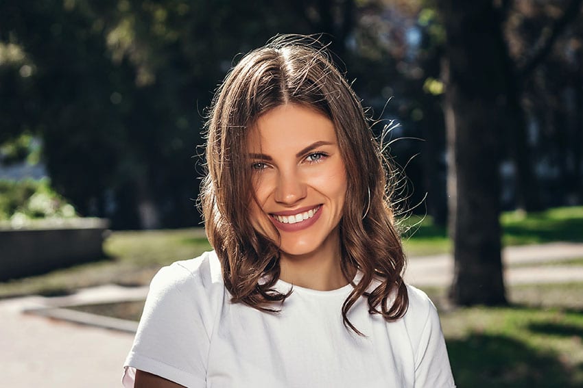 cute young woman taking a walk in the park