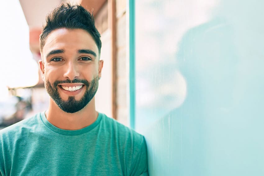 young man showing off his big smile